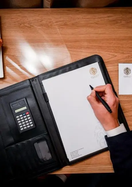 Guest signing on clipboard